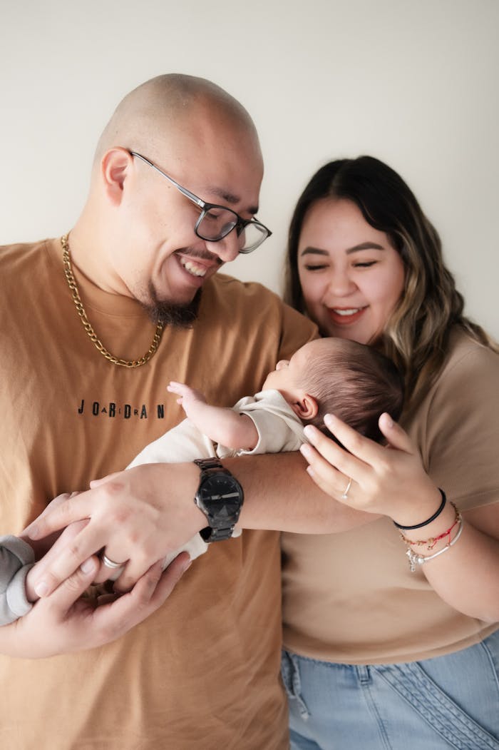 Parents Holding Their Newborn Baby